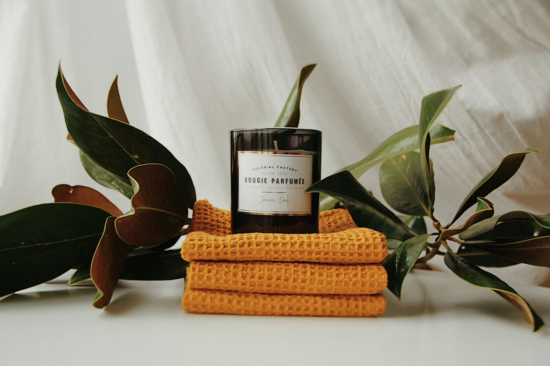 Botanical candle and textured spa linens
