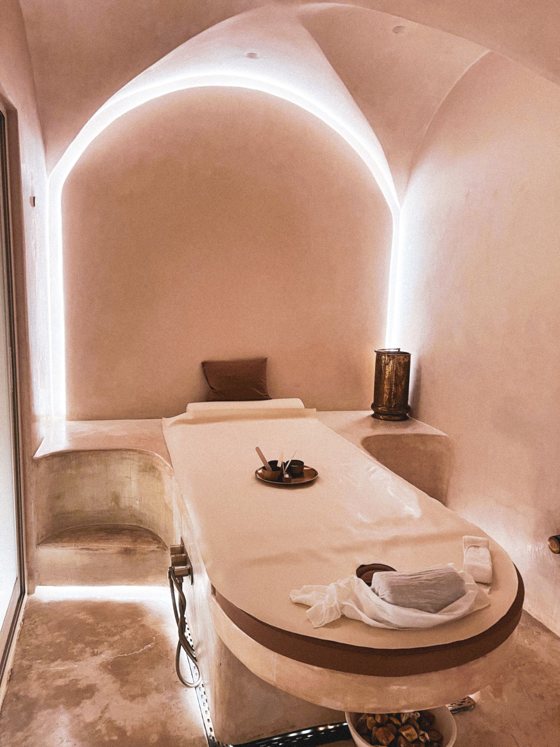 Sculptural treatment room with warm ambient lighting